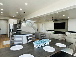 Dining space featuring recessed lighting, ceiling fan, and light wood finished floors