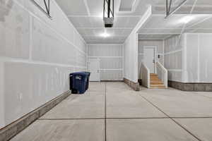 Garage featuring a garage door opener