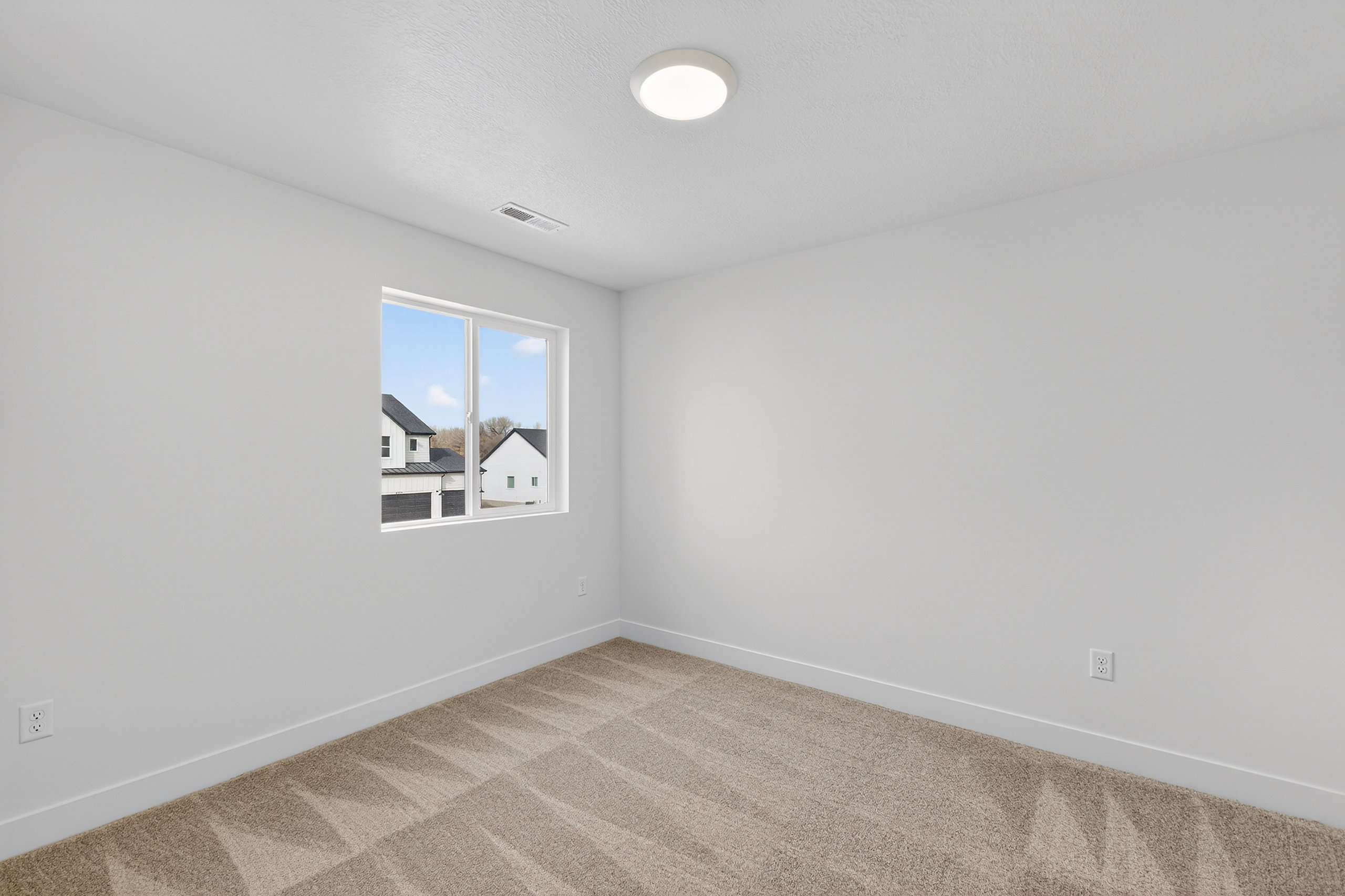 Unfurnished room featuring baseboards and carpet flooring