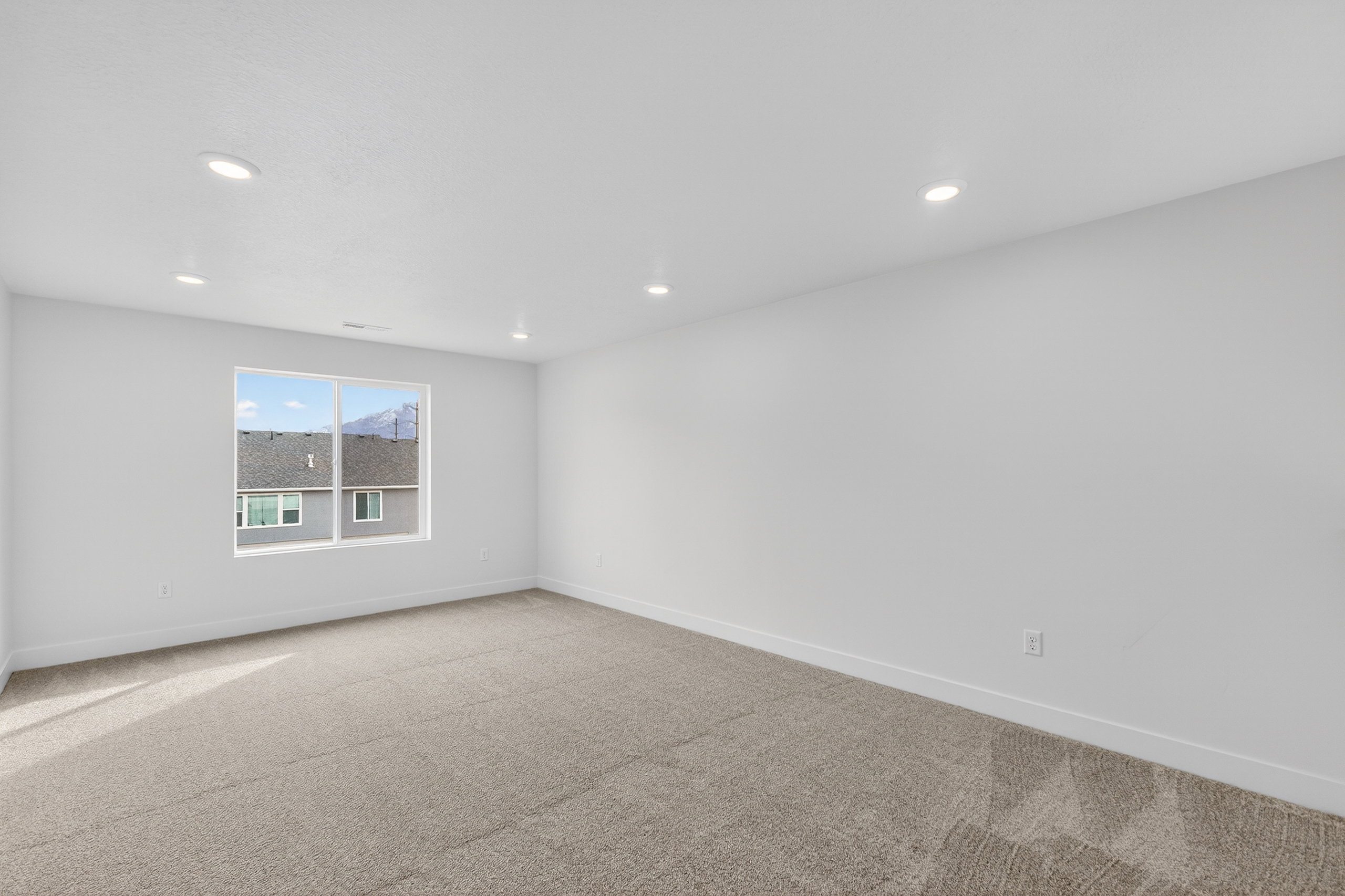 Unfurnished room with carpet floors and recessed lighting