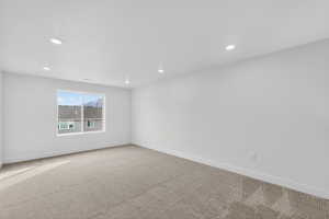 Unfurnished room with carpet floors and recessed lighting