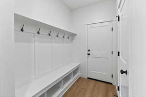 Mudroom featuring light wood finished floors