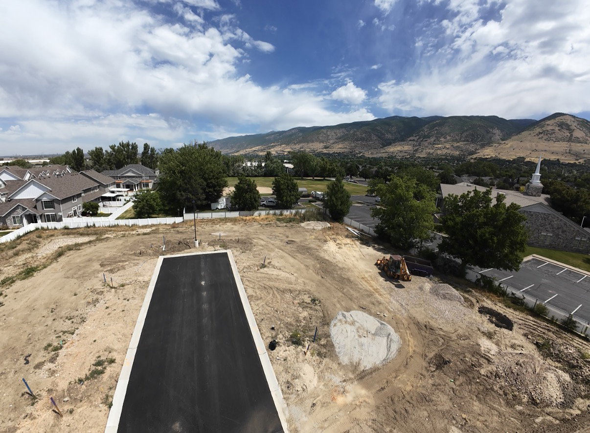Expansive lot with a newly paved driveway