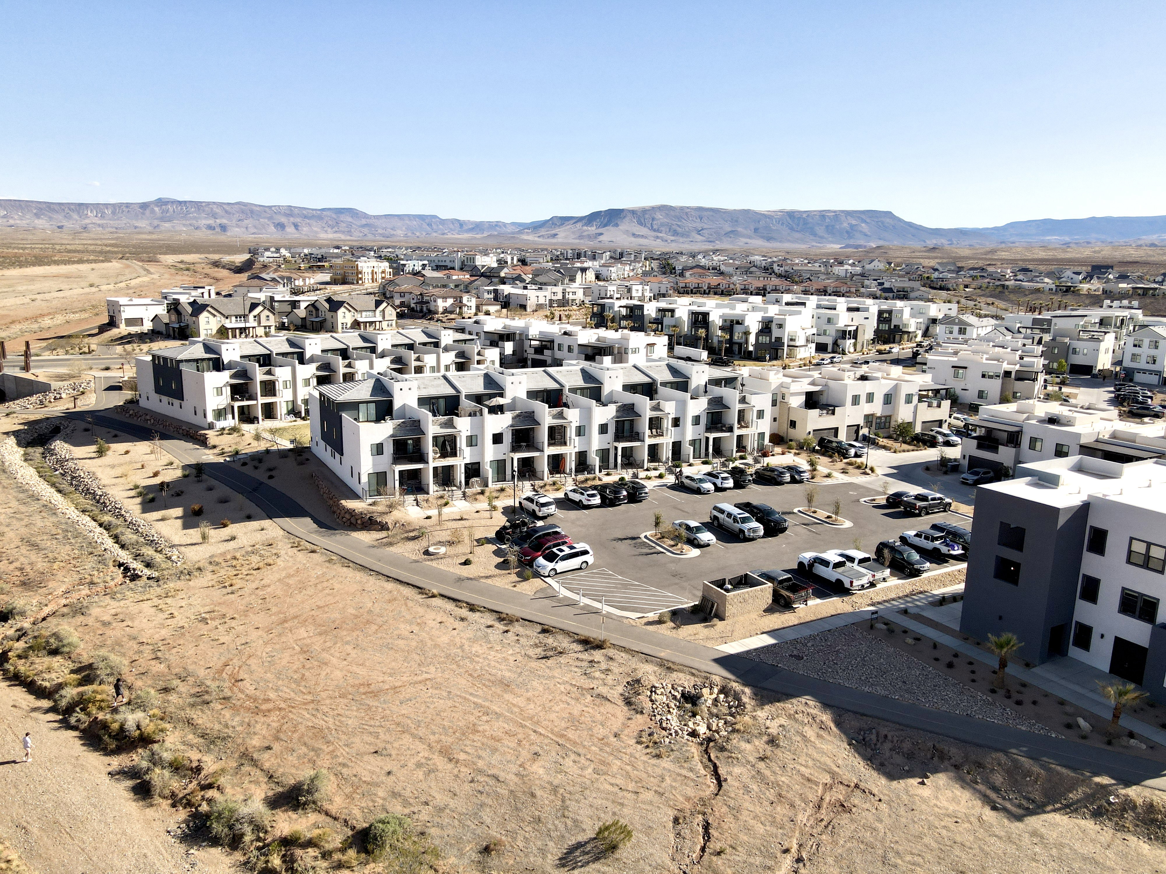 Aerial view of residential area featuring mountains