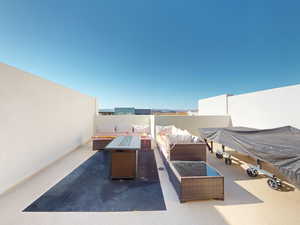 View of patio with an outdoor living space with a fire pit