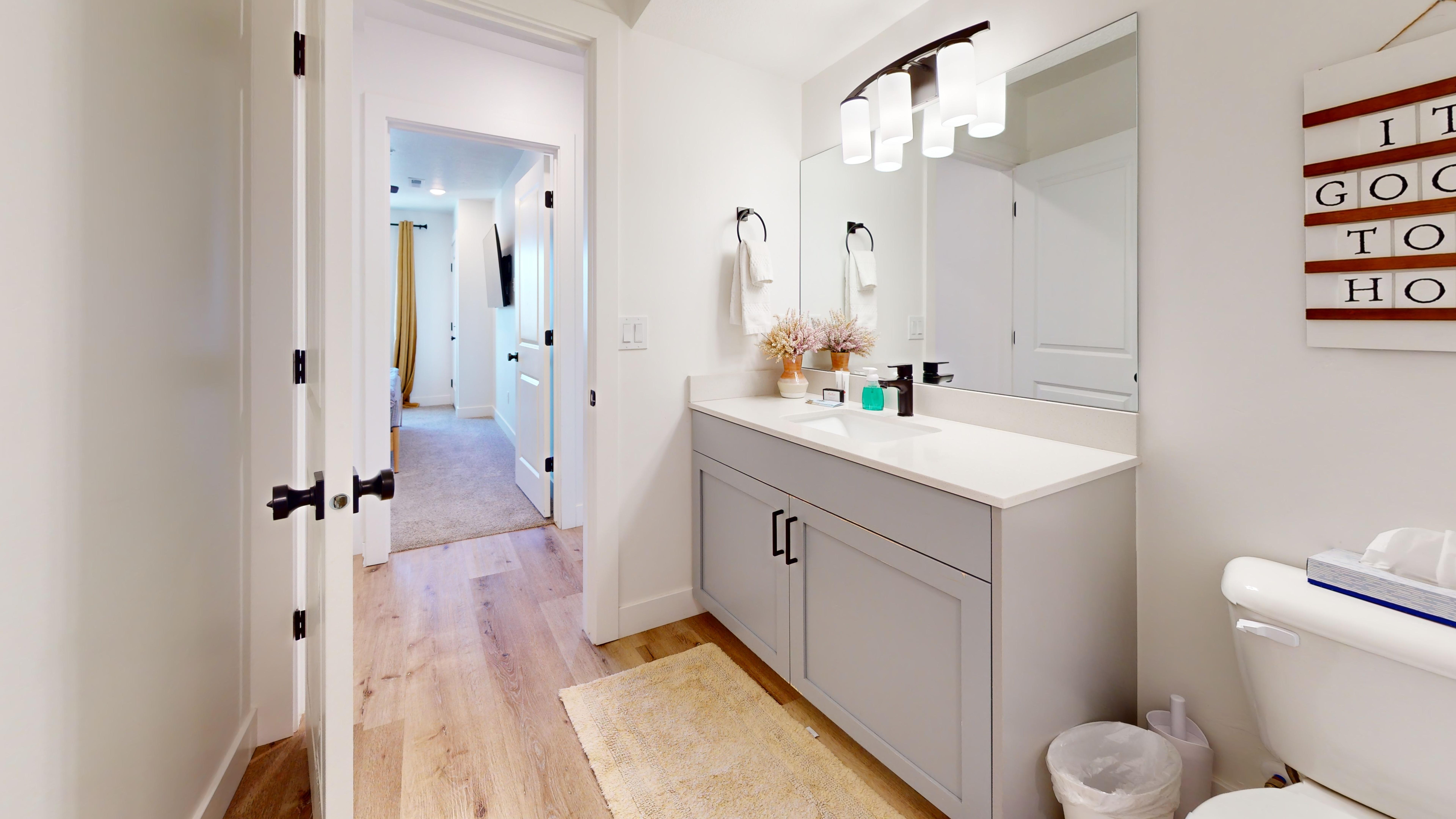 Bathroom with vanity and light wood-type flooring