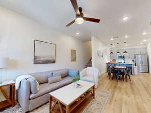 Living area featuring light wood-style flooring, recessed lighting, and ceiling fan