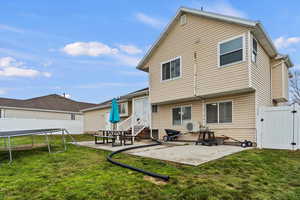 Large backyard cement pad ideal for entertaining