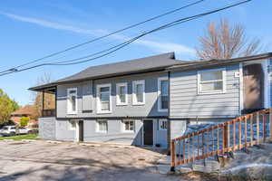 View of front of house featuring stucco siding
