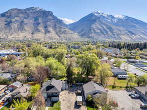 Aerial perspective of suburban area featuring a mountainous background