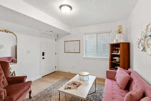 Living room with wood finished floors and baseboards