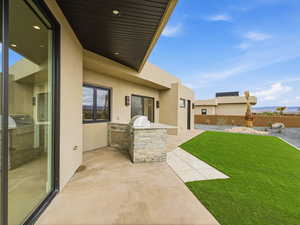 View of patio with an outdoor kitchen