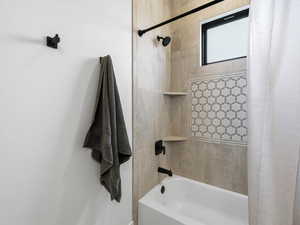 Full bath featuring shower / bath combo with shower curtain