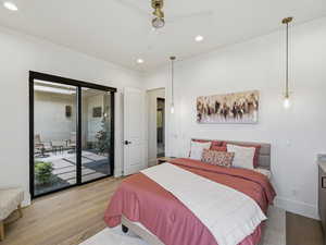 Bedroom with access to outside, wood finished floors, ceiling fan, and recessed lighting
