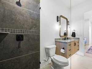 Full bath featuring vanity and toilet