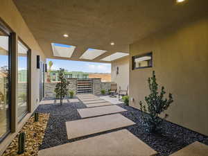 View of patio featuring a gate