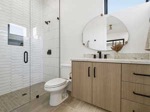 Bathroom with vanity and a shower stall