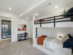 Carpeted bedroom featuring recessed lighting and baseboards