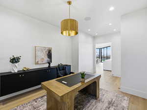 Office space featuring recessed lighting and light wood finished floors