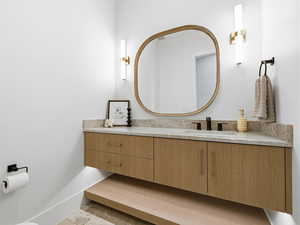 Half bathroom featuring vanity
