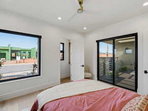 Bedroom featuring ceiling fan, access to outside, recessed lighting, and wood finished floors