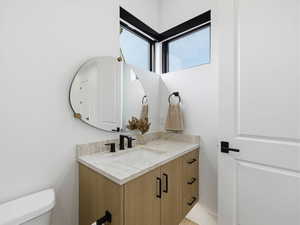 Bathroom with vanity and toilet