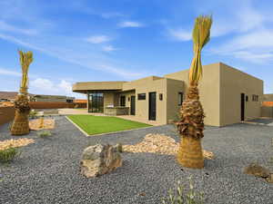 Back of house with stucco siding