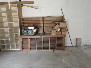 Detailed view of unfinished concrete flooring and ceiling fan