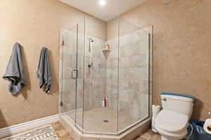 Main-level primary suite includes large walk-in closet and updated bath