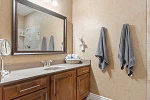 Main-level primary suite includes large walk-in closet and updated bath