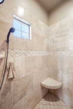Full bathroom with a tile shower