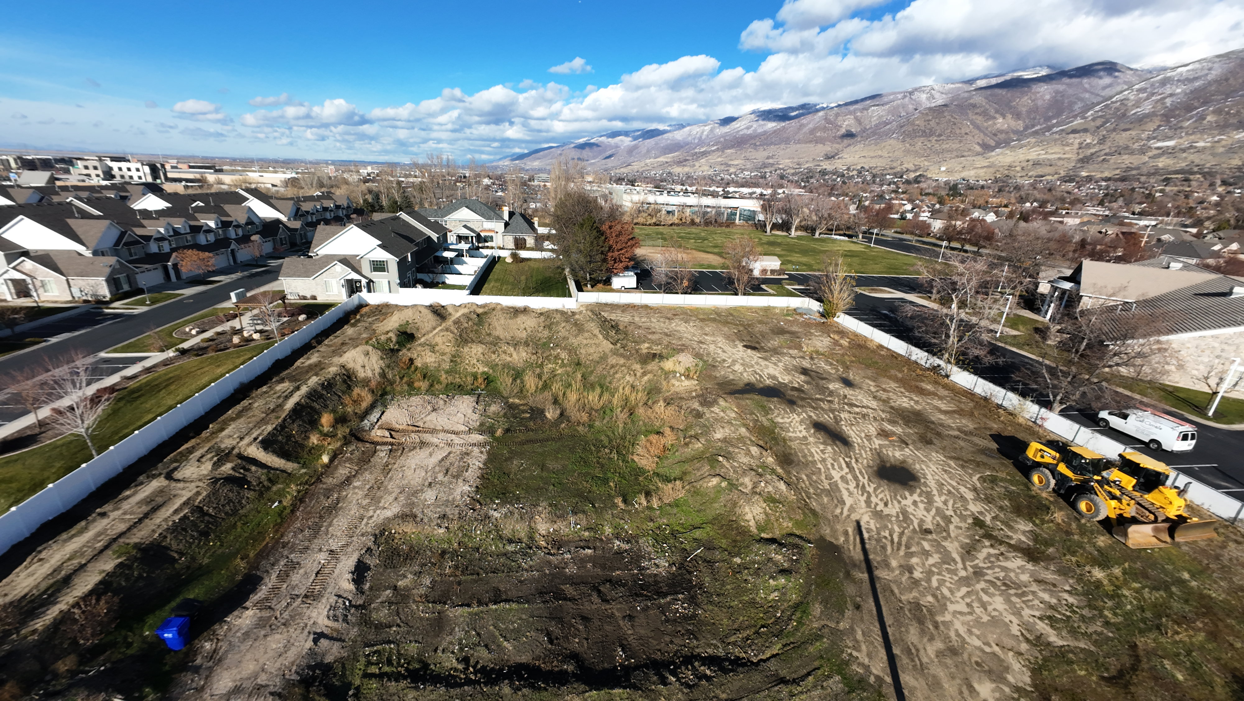 Aerial perspective of suburban area featuring a mountainous background