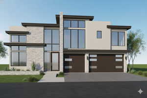 Modern home with stone siding, a garage, stucco siding, and driveway