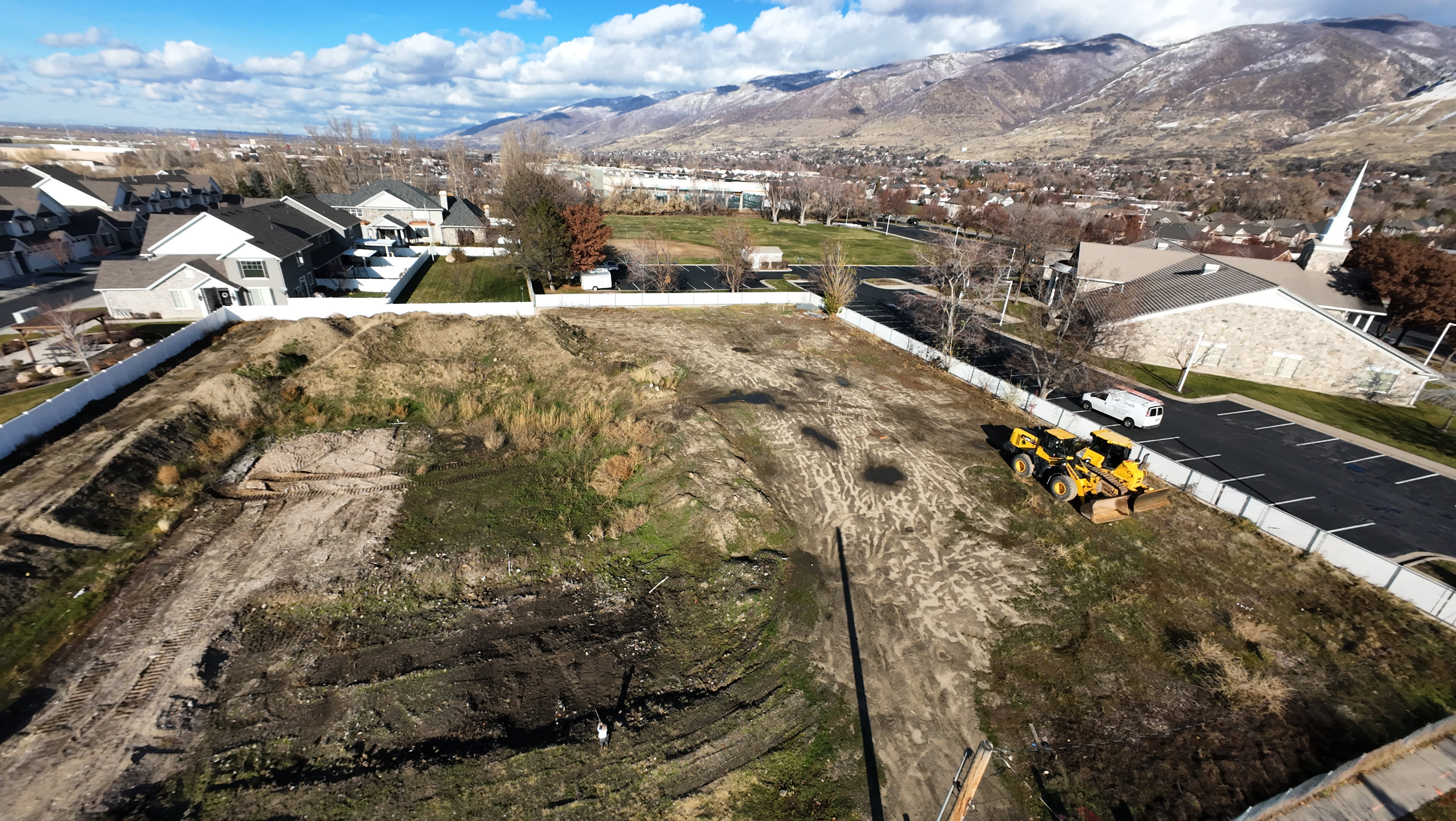 Aerial view of residential area featuring a mountainous background