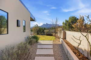 Fenced backyard with a mountain view