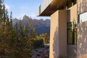 View of side of property featuring a mountain view and stucco siding