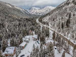 Snowy aerial view featuring a mountain view