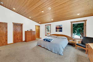 Bedroom featuring carpet, a vaulted wood ceiling, and recessed lighting