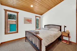 Bedroom featuring carpet floors, multiple windows, a vaulted wooden ceiling, and recessed lighting