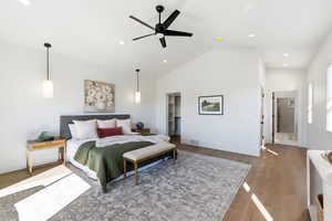 Bedroom featuring a ceiling fan, vaulted ceiling, wood finished floors, and recessed lighting