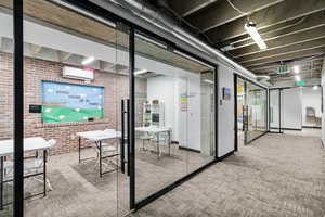 Common area with brick wall