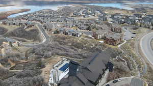 Aerial overview of property's location with a nearby body of water and nearby suburban area