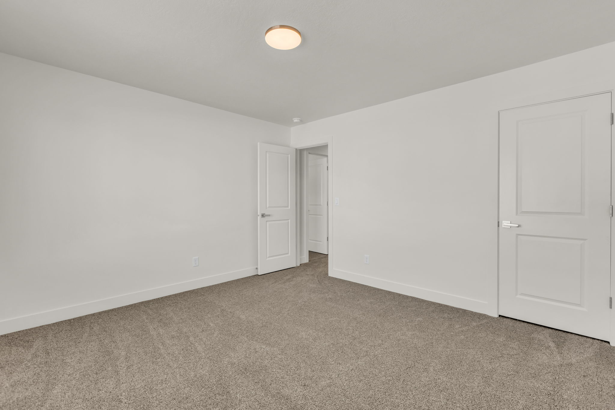 Unfurnished bedroom featuring carpet flooring and baseboards