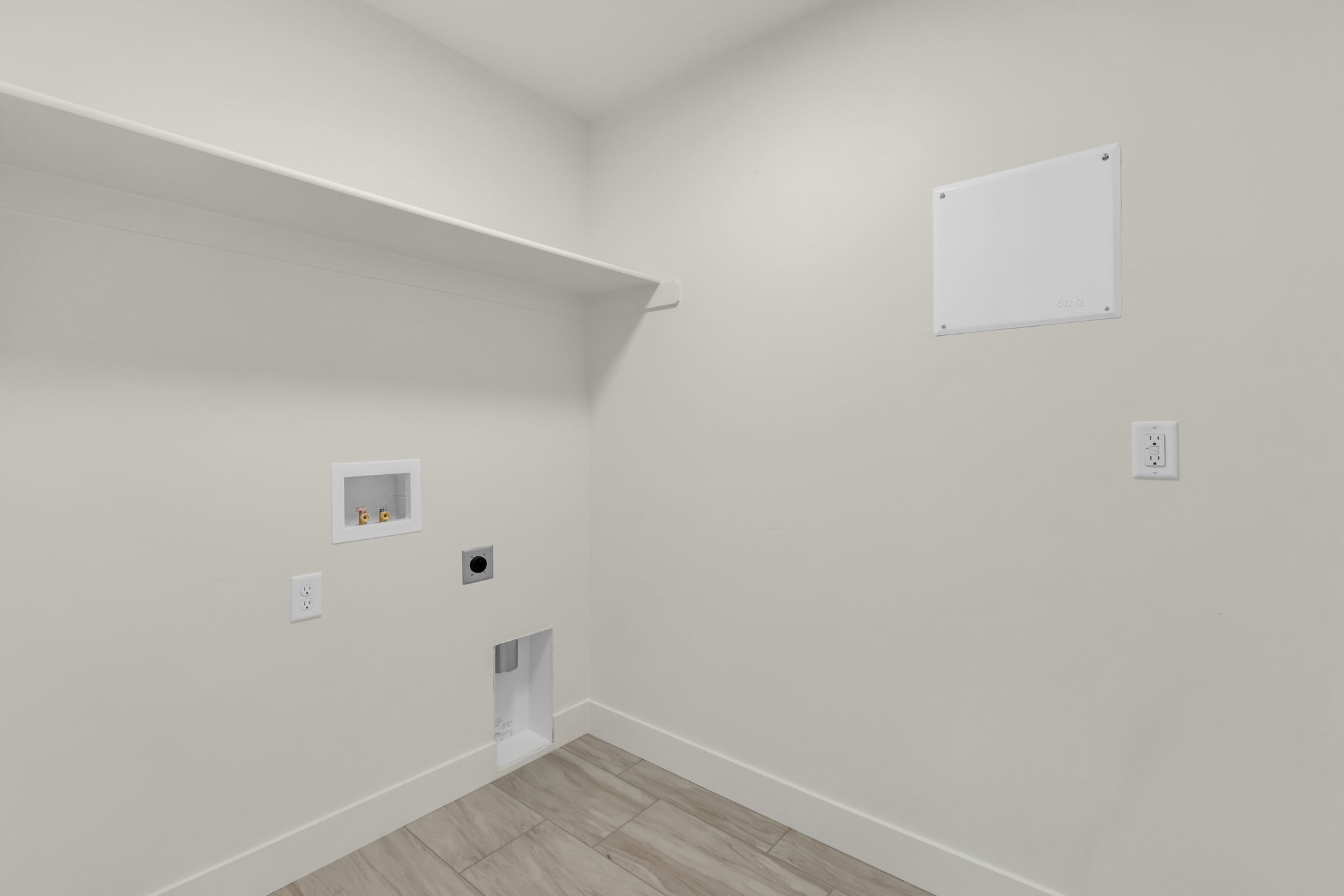 Laundry room featuring washer hookup, electric dryer hookup, and wood finish floors