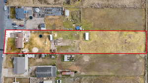 Aerial view of property and surrounding area featuring property boundaries highlighted