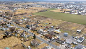 Aerial view of property's location featuring nearby suburban area and rural landscape