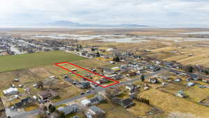View of property location with nearby suburban area, property parcel outlined, and rural landscape