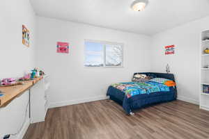Bedroom featuring LVP floors