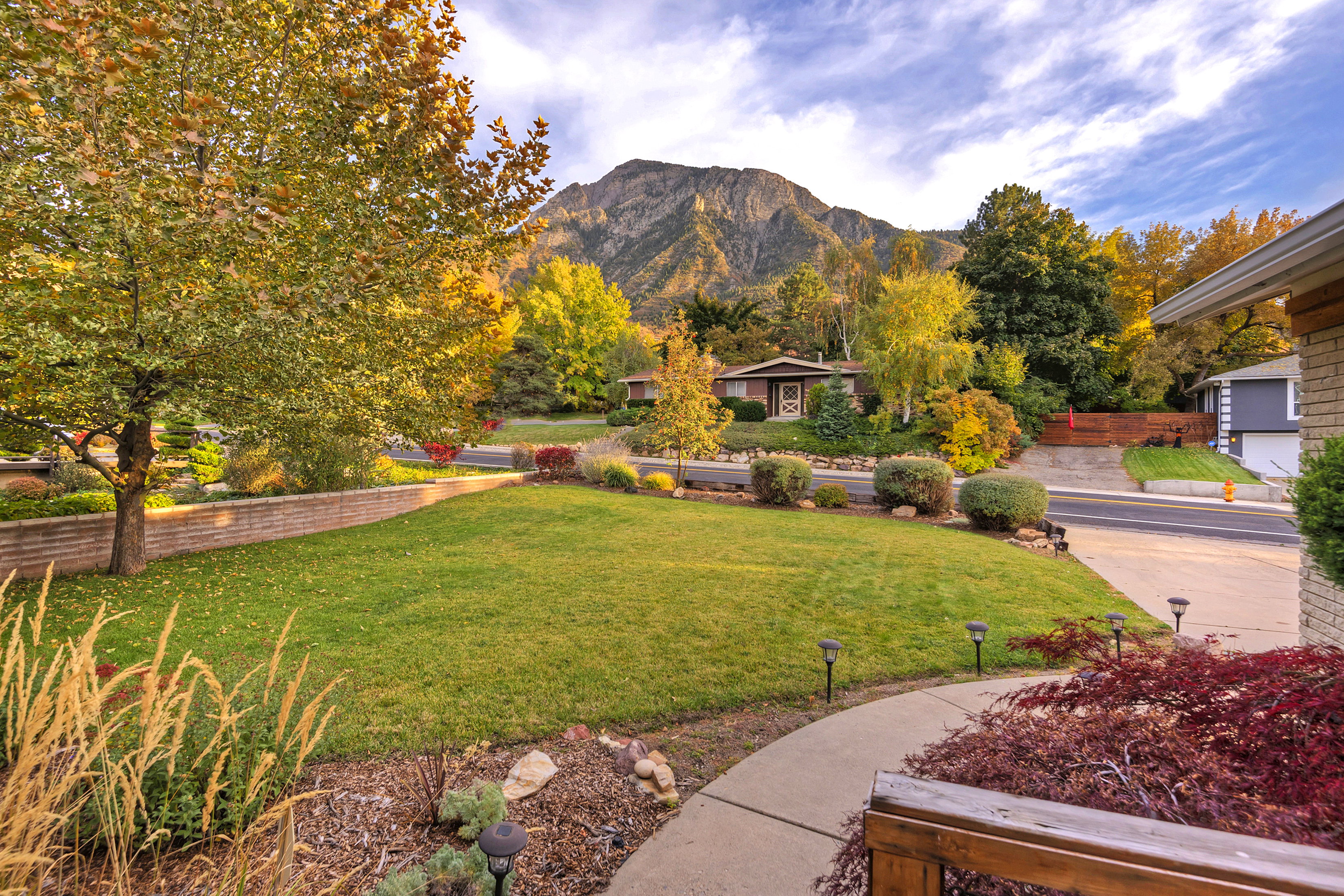 View of green lawn with a mountain view