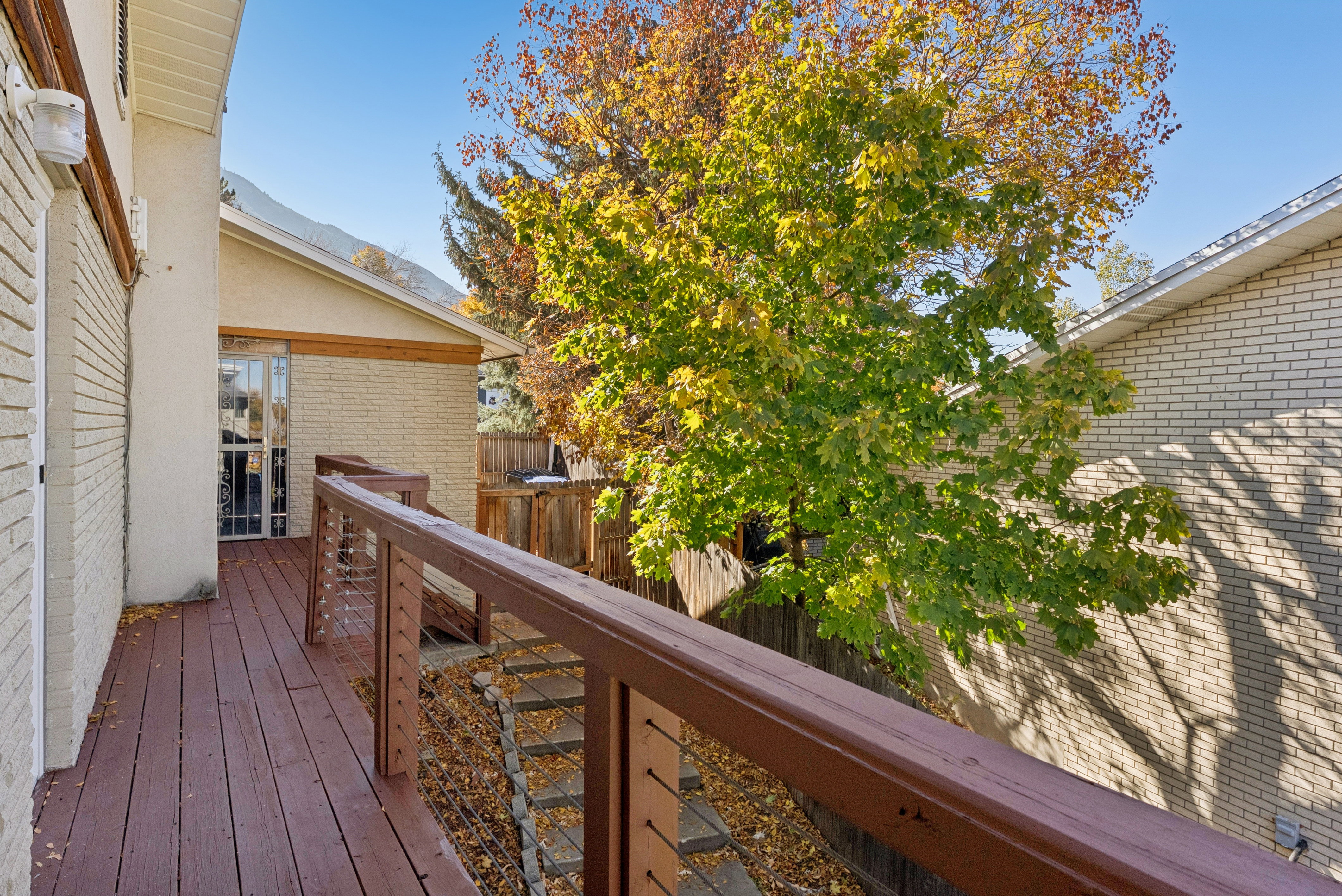 Deck with a fenced backyard